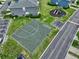 Aerial view of the community basketball court with a hopscotch area and playground nearby at 12661 Somerset Oaks St, Orlando, FL 32828