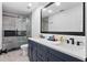 Stylish bathroom features double sinks, a large mirror, and a modern shower at 12661 Somerset Oaks St, Orlando, FL 32828