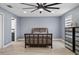 Well-lit bedroom boasts wood floors and a sleek ceiling fan for comfort at 12661 Somerset Oaks St, Orlando, FL 32828