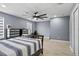 Spacious bedroom with a ceiling fan and desk area, perfect for relaxation and productivity at 12661 Somerset Oaks St, Orlando, FL 32828