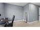 Bedroom featuring a desk, full-length mirror, and light-colored laminate flooring at 12661 Somerset Oaks St, Orlando, FL 32828