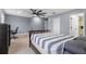 Large bedroom with a ceiling fan, desk area, and ample closet space at 12661 Somerset Oaks St, Orlando, FL 32828