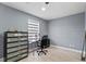 Bedroom featuring a desk, drawers, and light-colored laminate flooring at 12661 Somerset Oaks St, Orlando, FL 32828