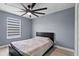 Bedroom with ceiling fan and large window at 12661 Somerset Oaks St, Orlando, FL 32828