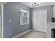 Cozy dining area with a view of the side yard and white double-door pantry at 12661 Somerset Oaks St, Orlando, FL 32828