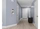 Inviting entryway featuring wood-look floors and convenient storage at 12661 Somerset Oaks St, Orlando, FL 32828