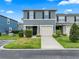 Charming two-story townhome with a one car garage and well-maintained landscaping at 12661 Somerset Oaks St, Orlando, FL 32828