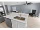 Modern kitchen with stainless steel sink, white cabinets, and stainless steel appliances at 12661 Somerset Oaks St, Orlando, FL 32828