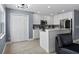 Modern kitchen with white cabinets, quartz countertops, and stainless steel appliances at 12661 Somerset Oaks St, Orlando, FL 32828