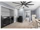 Bright laundry room with modern washer and dryer, closet, and tile floors at 12661 Somerset Oaks St, Orlando, FL 32828