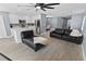 Open-concept living room with updated kitchen, modern appliances, and a dining room in view at 12661 Somerset Oaks St, Orlando, FL 32828
