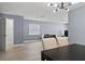 Open-concept living room and dining area with wood floors and lots of natural light at 12661 Somerset Oaks St, Orlando, FL 32828