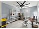 Bright office space features white flooring, a large window and a ceiling fan at 12661 Somerset Oaks St, Orlando, FL 32828