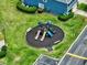 Community playground featuring slides, lush landscaping, and nearby neighborhood parking at 12661 Somerset Oaks St, Orlando, FL 32828