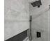 Modern shower featuring gray tiling, dual shower heads, and a sleek, built-in storage niche at 12661 Somerset Oaks St, Orlando, FL 32828