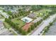 Aerial view of a community featuring a pool, playground, clubhouse and green spaces in a neighborhood setting at 1286 Tallow Rd, Apopka, FL 32703