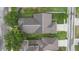 Aerial view of a well-maintained property showcasing the roof, landscaping, and surrounding neighborhood at 1286 Tallow Rd, Apopka, FL 32703