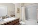 Standard bathroom featuring a shower-tub combination, a single sink vanity, and neutral finishes at 1286 Tallow Rd, Apopka, FL 32703
