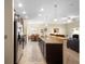 Open kitchen with granite countertops, stainless steel appliances, and breakfast bar at 1286 Tallow Rd, Apopka, FL 32703