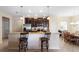 Kitchen features granite countertops, dark cabinets, and breakfast bar at 1286 Tallow Rd, Apopka, FL 32703
