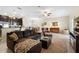 Comfortable living room area with a sectional sofa and open layout to the kitchen at 1286 Tallow Rd, Apopka, FL 32703