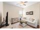 Living room featuring comfortable seating, a modern TV, and a neutral color palette at 1286 Tallow Rd, Apopka, FL 32703