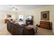 Inviting living room with a comfortable sofa, fireplace, and access to an outdoor patio at 1286 Tallow Rd, Apopka, FL 32703
