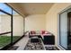 Screened porch with patio furniture, offering a relaxing outdoor living space at 1286 Tallow Rd, Apopka, FL 32703