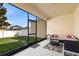 Screened porch with patio furniture and views of the lawn at 1286 Tallow Rd, Apopka, FL 32703