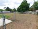 Large, fenced backyard with a combination of dead and green grass at 130 Krider Rd, Sanford, FL 32773