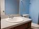 Bathroom with a clean white sink, vanity, toilet, and a large mirror at 130 Krider Rd, Sanford, FL 32773