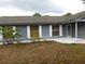 Charming single-story home with neutral gray exterior and tidy landscaping at 130 Krider Rd, Sanford, FL 32773