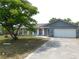 Charming single-story home featuring a spacious front yard and an attached one-car garage at 130 Krider Rd, Sanford, FL 32773