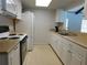 Functional kitchen with white cabinets and appliances, and laminate countertops at 130 Krider Rd, Sanford, FL 32773