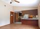 Open concept living room, featuring a kitchen with a breakfast bar and tile flooring at 130 Krider Rd, Sanford, FL 32773