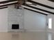 Spacious living room with vaulted ceilings, ceiling fans and a charming white-brick fireplace at 130 Krider Rd, Sanford, FL 32773