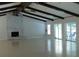 Open living area with vaulted ceilings, fireplace, and sliding glass doors to a patio at 130 Krider Rd, Sanford, FL 32773