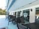 An outdoor seating area, with tables and chairs, provides a comfortable spot for residents to relax and enjoy each others company at 130 Krider Rd, Sanford, FL 32773