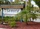 Entrance to the Sanora community, nestled among lush tropical landscaping at 130 Krider Rd, Sanford, FL 32773