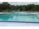 The community pool offers a refreshing escape from the heat, complete with lane markers for exercise and lounge chairs for relaxation at 130 Krider Rd, Sanford, FL 32773