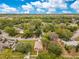 Expansive aerial perspective of the property, surrounded by green spaces and residential streets at 1371 Lake Dr, Casselberry, FL 32707