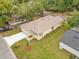 Aerial view of a charming home showcasing the manicured lawn and convenient driveway and porch at 1371 Lake Dr, Casselberry, FL 32707
