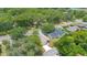 Aerial view showing the home's placement on its lot, surrounded by trees at 1371 Lake Dr, Casselberry, FL 32707