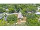 Real estate aerial view of a home with lush greenery and a well-kept lawn in a residential neighborhood at 1371 Lake Dr, Casselberry, FL 32707