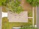 Birds eye view of a well-maintained roof, lush landscaping, and an inviting yard at 1371 Lake Dr, Casselberry, FL 32707