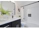 Elegant bathroom with contemporary fixtures, a tub-shower combo, and stylish decor at 1371 Lake Dr, Casselberry, FL 32707