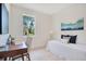 Relaxing bedroom with a view, complemented by a study area and natural light at 1371 Lake Dr, Casselberry, FL 32707