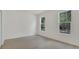 Inviting bedroom featuring two windows and hardwood floors at 1371 Lake Dr, Casselberry, FL 32707