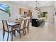 Open concept dining area next to a modern kitchen featuring an island with seating at 1371 Lake Dr, Casselberry, FL 32707