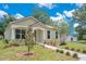Charming home with a well-maintained lawn, landscaped walkway, and inviting front entrance at 1371 Lake Dr, Casselberry, FL 32707